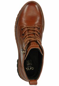 Brown leather ankle boot with round toe, lace-up front, zipper on the side, and textured rubber outsole. Interior has a black lining.