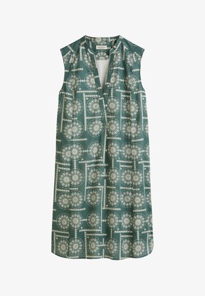 Mouwloze jurk van teal stof met een geometrisch wit patroon met cirkelvormige motieven en een open halslijn. Zachte, lichte textuur.