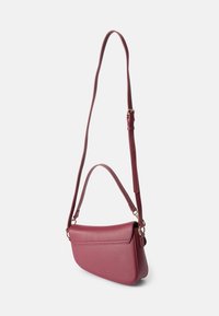 Burgundy leather crossbody bag with a textured surface, a flap closure, an adjustable strap, and gold-tone hardware accents.