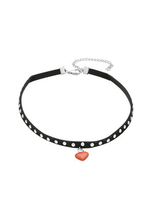 Black choker made of suede with silvery circular studs, featuring a small orange heart pendant and a silver clasp with an extension chain.