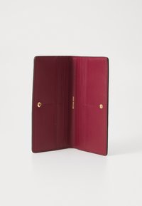 Leather wallet in black with a burgundy interior, featuring multiple card slots and a gold snap closure. Simple design with clean lines.
