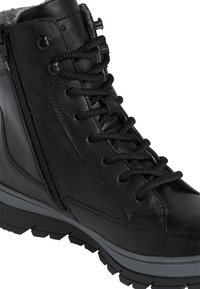 Black leather boot with a textured surface, featuring gray rubber sole, lace-up front, and side zipper for easy access.