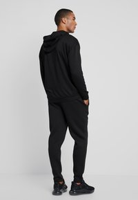 Urban Classics CUT AND SEW PANTS - Jogginghose - black