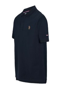 Polo bleu marine en coton, doté d'un col côtelé, de manches courtes et d'un logo brodé sur la poitrine.
