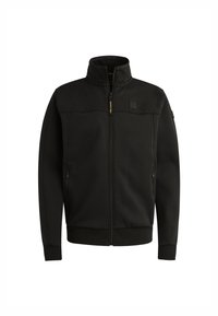 Chaqueta negra de cremallera hecha de tela suave, con un panel superior texturizado, cuello y bolsillos laterales. Los puños y el dobladillo acanalados ofrecen un ajuste ceñido.