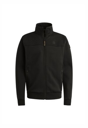 Giacca nera con zip realizzata in un tessuto morbido, con un pannello superiore testurizzato, colletto e tasche laterali. I polsini e l'orlo a costine offrono un look aderente.