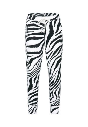Schwarz-weiß gestreifte Jogginghose mit Zebra-Muster, elastischem Bund und weißem Kordelzug, enganliegenden Bündchen an den Knöcheln.