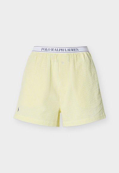 Κίτρινα και λευκά ριγωτά μποξεράκια Polo Ralph Lauren με ελαστική μέση και κουμπωτό καβάλο, απεικονιζόμενα σε απλό φόντο.