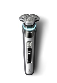 Philips i9000 Prestige elektrische scheerapparaat in zilver met drie roterende scheerkoppen, digitaal display met batterijpercentage en blauwe accenten.