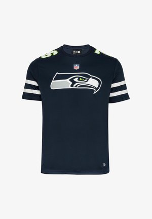 T-shirt a maniche corte blu navy realizzato in tessuto liscio, con un grande logo dei Seattle Seahawks e strisce bianche sulle maniche.