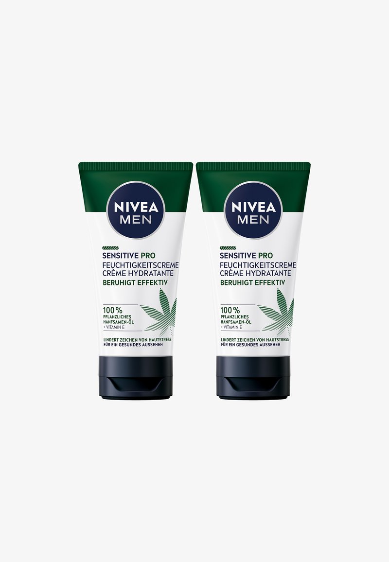 Two green and white tubes of Nivea Men Sensitive Pro moisturizing cream, featuring a cannabis leaf graphic and black caps.