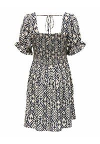 Robe tunique smockée avec des manches courtes à volants, présentant un motif ikat bleu marine et crème et un décolleté carré à l'arrière avec une finition à nouer.