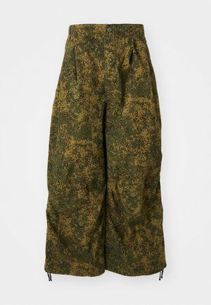 Wide-leg pants with green and brown pixelated camouflage print, button closure, and drawstrings at the hems.