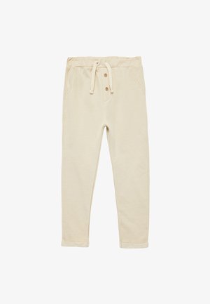 Beige bomulds sweatpants med elastisk talje, forlommer og to træknapper ved taljen. Tapered ben med manchetter ved anklerne.
