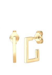 Guldfarvede stud �øreringe med et geometrisk kvadratisk design, der har en lige stang og et åbent kvadrat. Fremstillet af metal med en glat overflade.