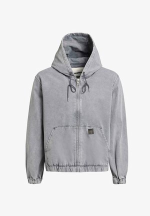 Svetlosivá mikina na zips s kapucňou, sťahovacie šnúrky, elastické manžety, predné vrecká a malá značka na spodnom prednom diele.