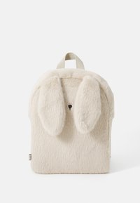 Furry cream backpack with bunny ears, rounded shape, small nose detail, and a top handle. Soft texture and playful design.