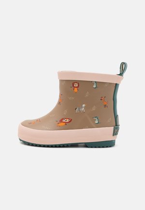 Botte de pluie en caoutchouc de couleur beige avec des bordures roses et une semelle texturée ; présente des motifs animaliers incluant un lion, une girafe et un zèbre.