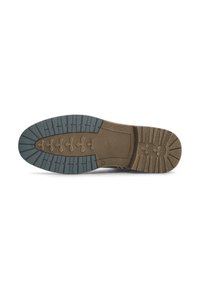 Suela de zapato con una base de goma marrón texturizada, que presenta una banda de rodadura en gris oscuro con un patrón para un mejor agarre y acentos de líneas detallados.