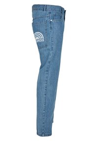 Vaaleansiniset suorat farkut, joissa on sivutaskut. Takataskussa on valkoinen sateenkaari grafiikka, jossa lukee "SOUTHPOLE".