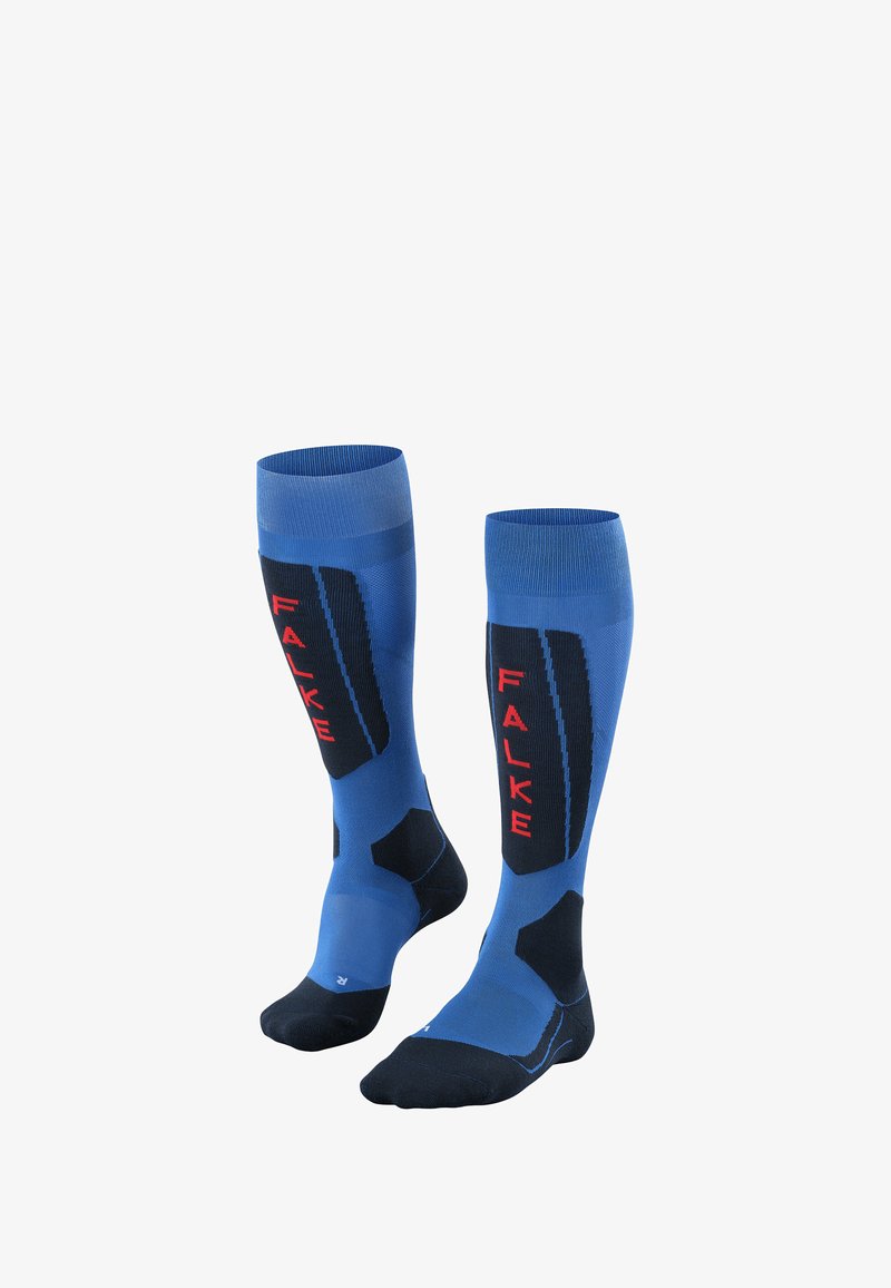 Calze atletiche blu fino al ginocchio con accenti neri e logo rosso. Presentano motivi testurizzati e zone di supporto per il comfort durante l'attività.