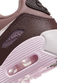 Brown leather sneaker with a textured finish; features a pink, translucent air unit in the sole and "Air Max" branding on the side.