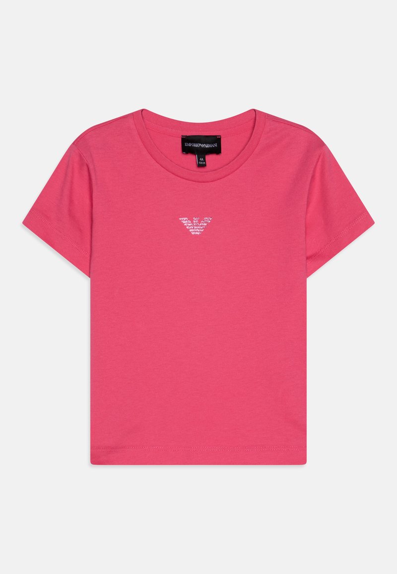 Rozā kokvilnas T-krekls ar apaļu kakla izgriezumu un īsām piedurknēm, kurā centrā ir neliels, diskrēts balts logo.