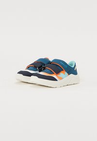 Blue and white athletic shoes with orange accents, featuring a mesh upper, two adjustable Velcro straps, and a textured rubber sole.
