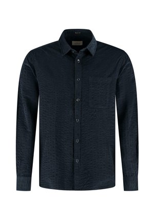 Heren overhemd met lange mouwen in donker marineblauw, gemaakt van een gestructureerde stof met een button-down kraag en een enkele borstzak. Voorzien van klassieke knoopsluiting.