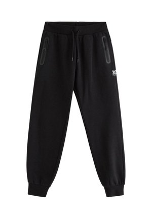 Sorte joggingbukser med snøre i taljen, lynlåslommer på begge sider, elastiske manchetter og lille hvidt logo på højre lår.