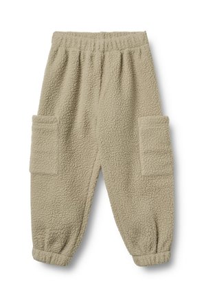 Pantalons de jogging en polaire beige avec taille élastique, poignets élastiques et grandes poches latérales rectangulaires.