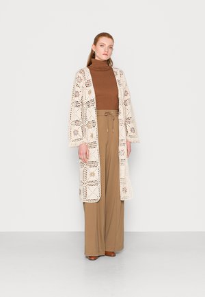 Auf welche Kauffaktoren Sie zuhause bei der Auswahl der Cream strickjacke Acht geben sollten