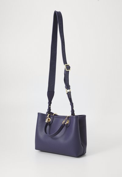 Purple handbag with dual handles and an adjustable strap, featuring gold hardware and textured leather, set against a light background.