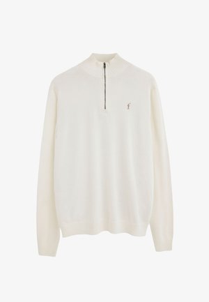 Maglione a maniche lunghe color crema con collo alto a costine e mezza cerniera, con una piccola figura ricamata sul petto.