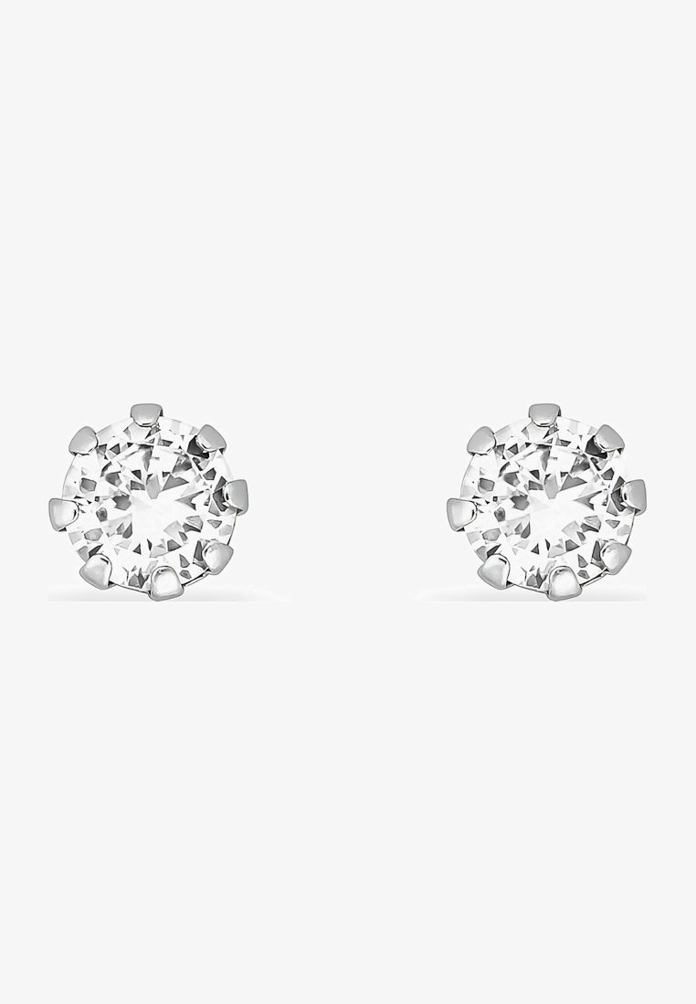Orecchini a bottone rotondo con pietre in zirconia cubica trasparente, montate a griffes, realizzati in metallo di colore argento. Ogni pietra è sfaccettata, aumentando la brillantezza.
