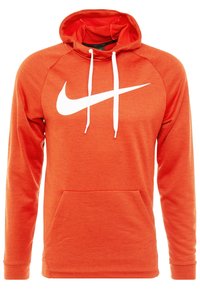 Sweat à capuche orange avec une finition texturée, arborant un logo Nike blanc, des cordons de serrage réglables et une poche avant.