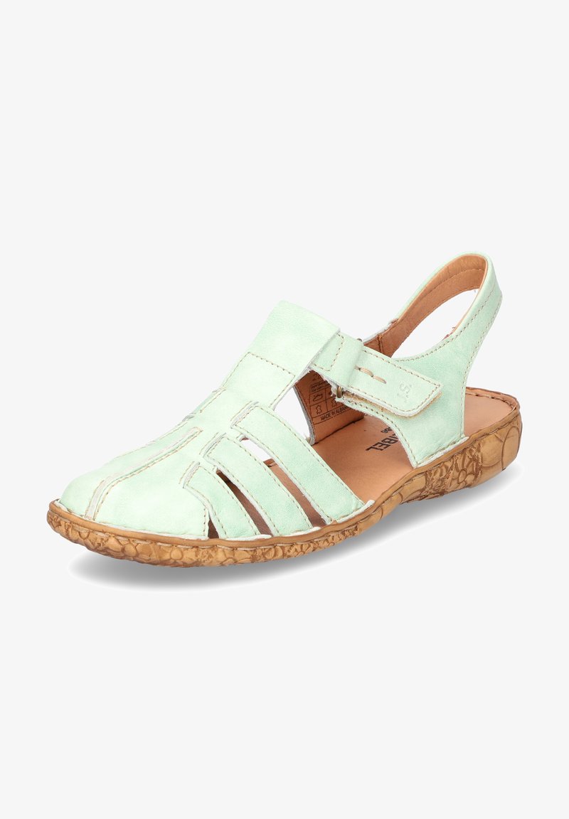 Se καθημερινά σε πανέμορφα γόνατα, σε έντονη πράσινη απόχρωση με ανοιχτή μύτη, σταυρωτές ρίγες και υφασμάτινη καφέ σόλα. Διαθέτει ρυθμιζόμενο λουράκι στο πίσω μέρος για ασφαλή εφαρμογή.