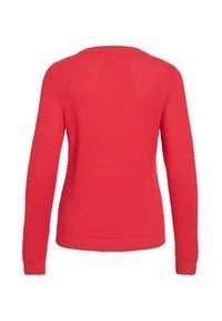 Punainen neulottu villapaita, jossa on teksturoitu kuvio, pitkät hihat ja pyöreä kaula-aukko, resorireunus helmassa ja hihansuissa.