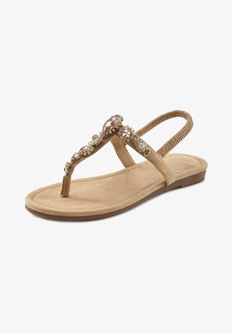 Beige flat sandals with a toe loop, featuring a jeweled strap adorned with pink and clear stones. Soft suede texture, low profile sole.