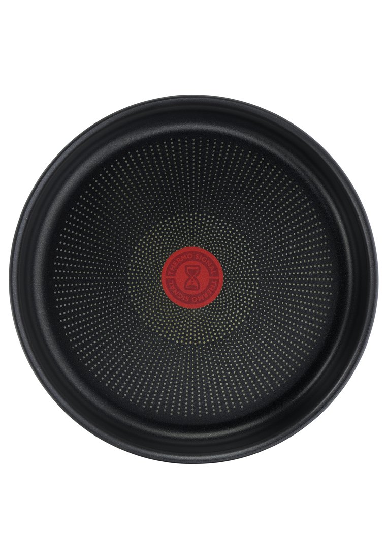 Schwarzes, antihaftbeschichtetes Pizzatablett mit glatter Oberfläche, geprägt mit kleinen Punkten, die von einem zentralen roten Thermo-Signal-Logo ausgehen.