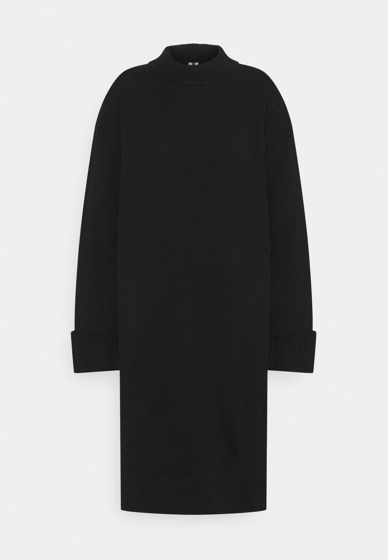 Robe-pull en tricot noir à manches longues avec col montant côtelé et larges poignets côtelés, ourlet mi-long.