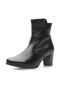 Bottine en cuir noir avec bout pointu et talon bloc, texture lisse et hauteur mi-mollet, photographiée sur fond blanc.