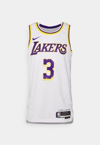 Maglia da basket bianca con la scritta "LAKERS" in viola e giallo, numero "3" in viola con contorno giallo, logo Nike sulla spalla.