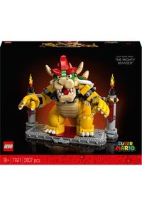 LEGO model of Bowser with yellow, red, and green elements. Features a detailed face, claws, a throne-like base, and flame accents.