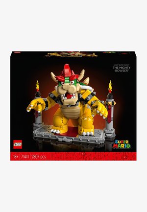LEGO model of Bowser with yellow, red, and green elements. Features a detailed face, claws, a throne-like base, and flame accents.