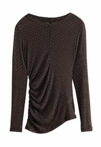 Brun langærmet bluse med diskret ribbede detaljer og spredte sølv prikker. Har en rund halsudskæring og sidelægning for en tætsiddende silhuet.