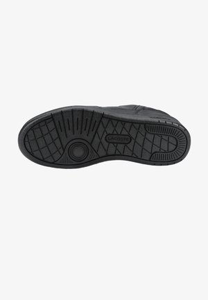 Czarna podeszwa sneakersa z teksturowanym wzorem bieżnika i nazwą marki "Lacoste" wytłoczoną na środku.