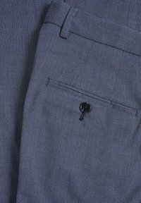 Dark blue textured trousers with a subtle check pattern, featuring a back pocket with a black button and a smooth waistband.