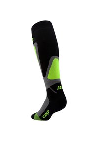Calza compressiva nera con accenti verde neon e grigio, design al ginocchio, soletta testurizzata e logo sulla suola.