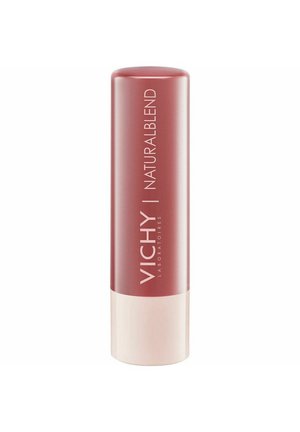 Vichy Natural Blend lip product in a cylindrical container, featuring a deep rose color and a cream-colored base with branded lettering.